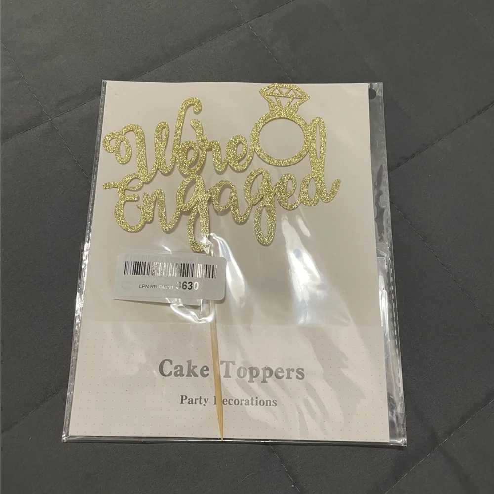 We’re engaged cake topper